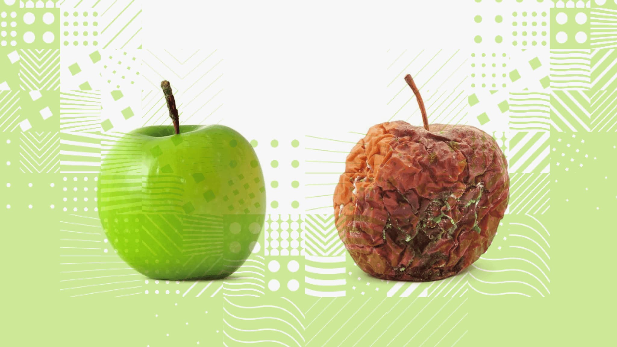 Fresh green apple next to a shriveled, brown apple on a patterned green background, illustrating contrast in fruit freshness.
