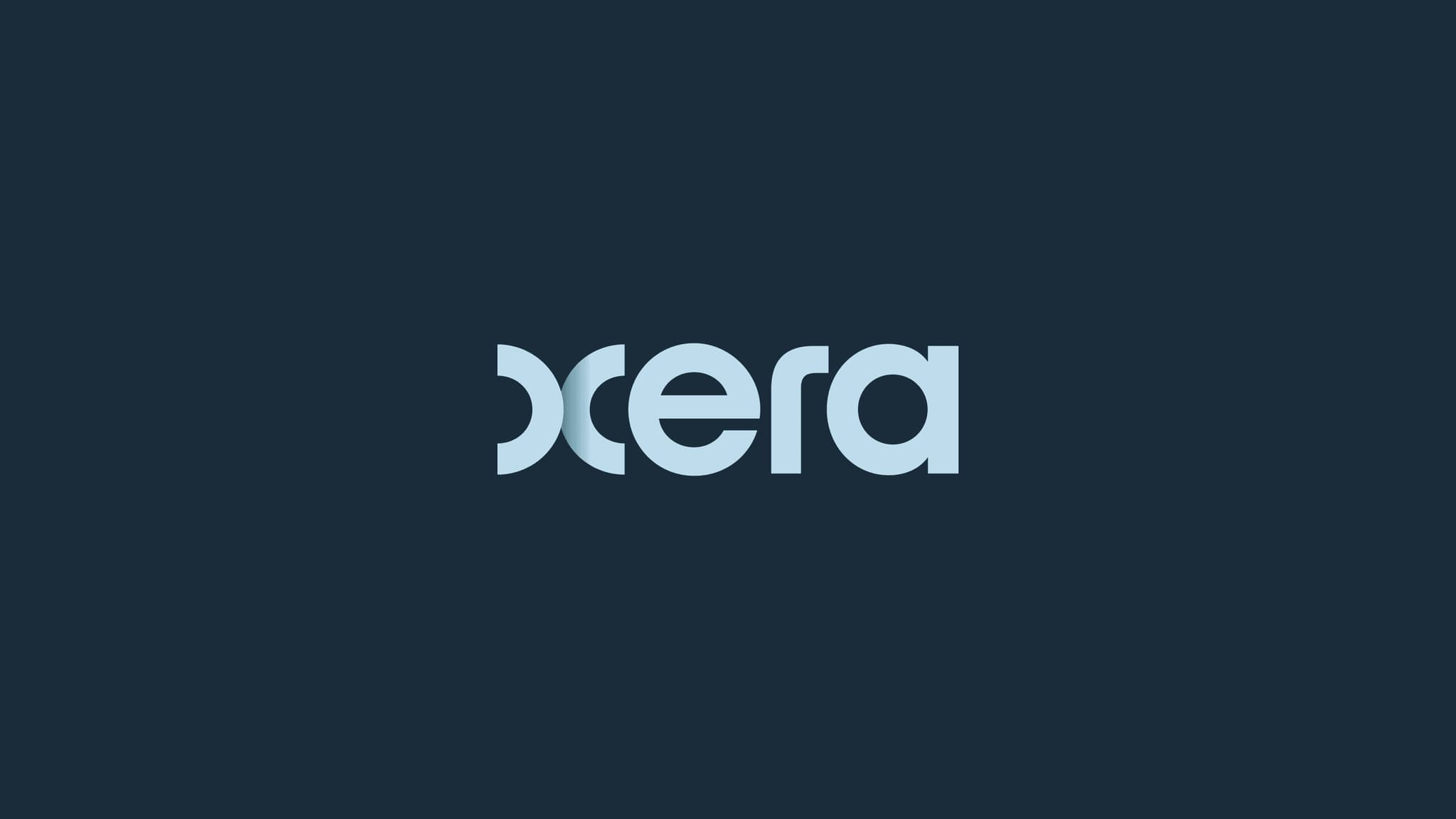 Light blue logo of "Oxera" on a dark blue background, featuring modern typography design.