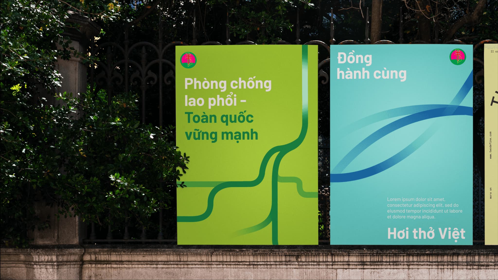 Two vibrant outdoor signs in green and teal featuring Vietnamese text promoting national health initiatives, surrounded by greenery.