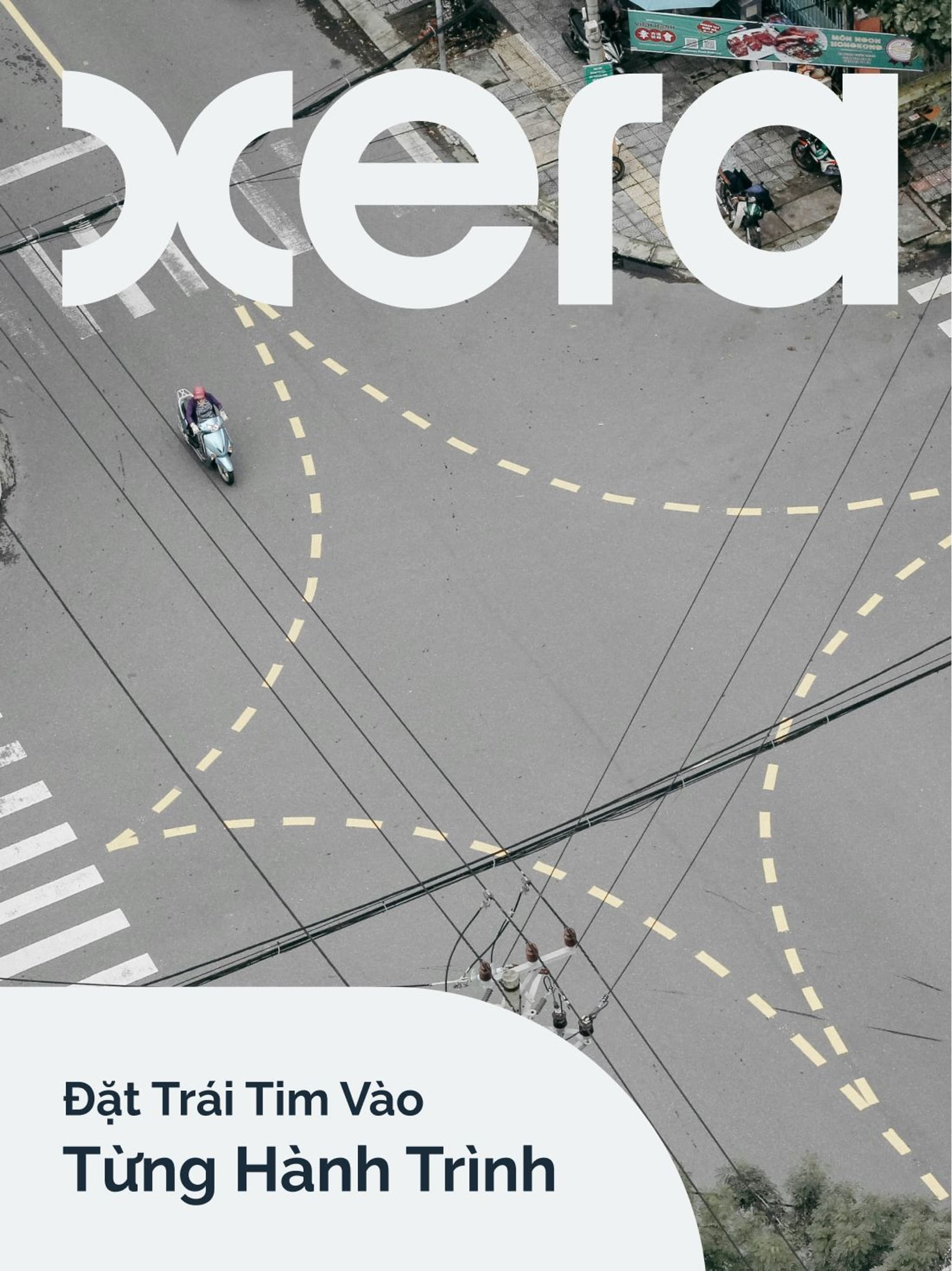 Aerial view of a road with motorbikes, featuring the text "xera" and "Đặt Trái Tim Vào Từng Hành Trình."