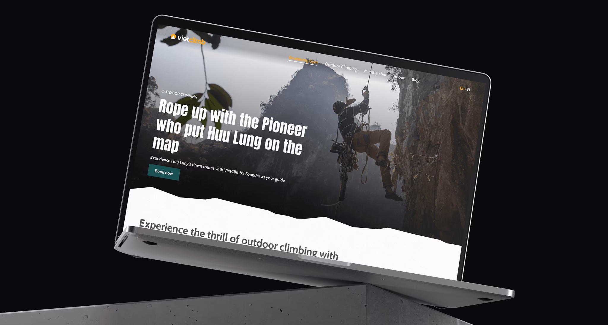 Desktop mockup displaying an outdoor climbing website featuring a climber on a rock face.