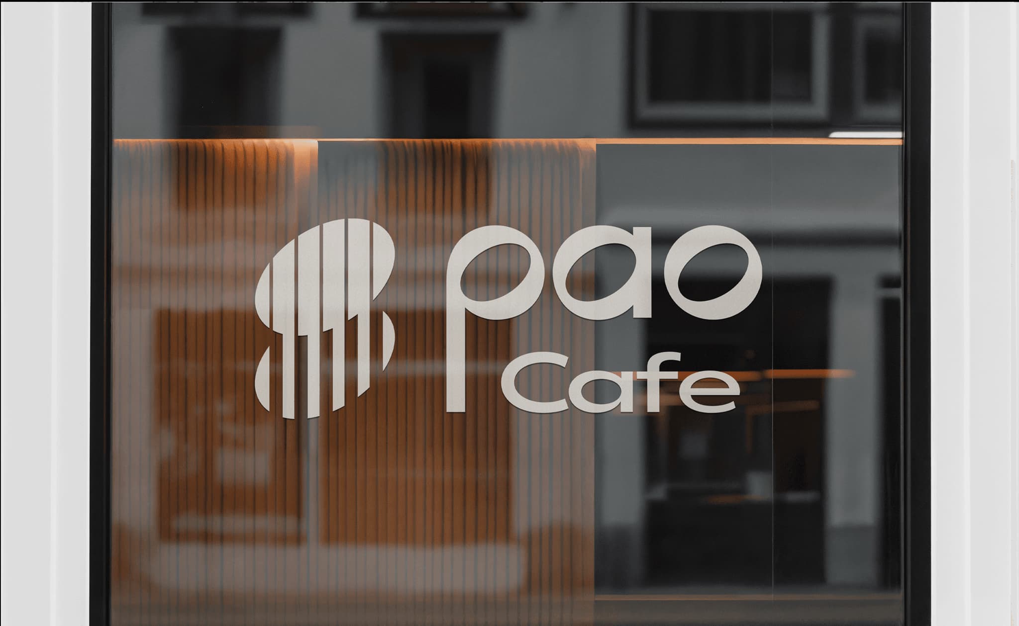 Stylish logo of Pao Cafe featuring modern typography on a storefront window.
