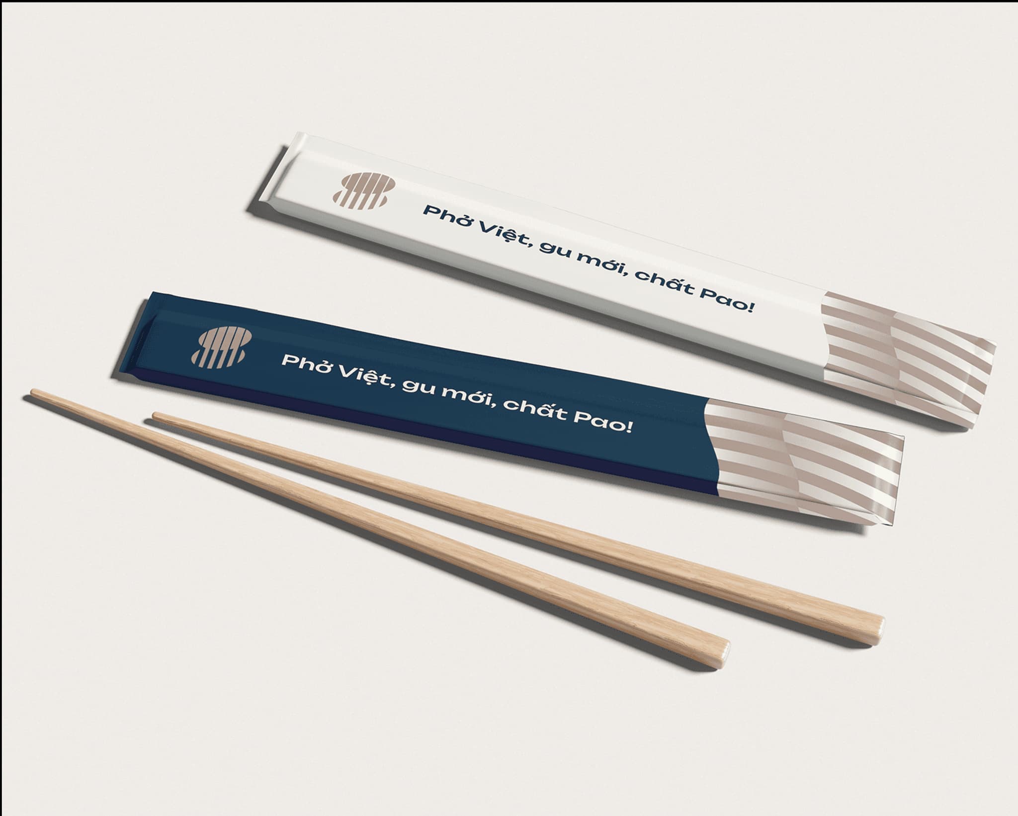 Vietnamese Pho packaging mockup featuring chopsticks and a sleek design with the text "Phở Việt, gu mới, chất Pao!"