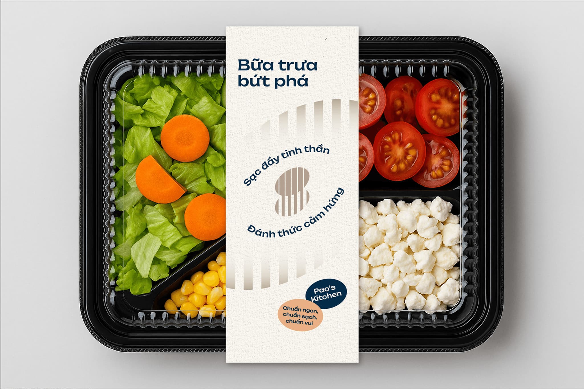 Colorful plastic food container filled with fresh vegetables, including lettuce, carrots, tomatoes, and corn, with branding.