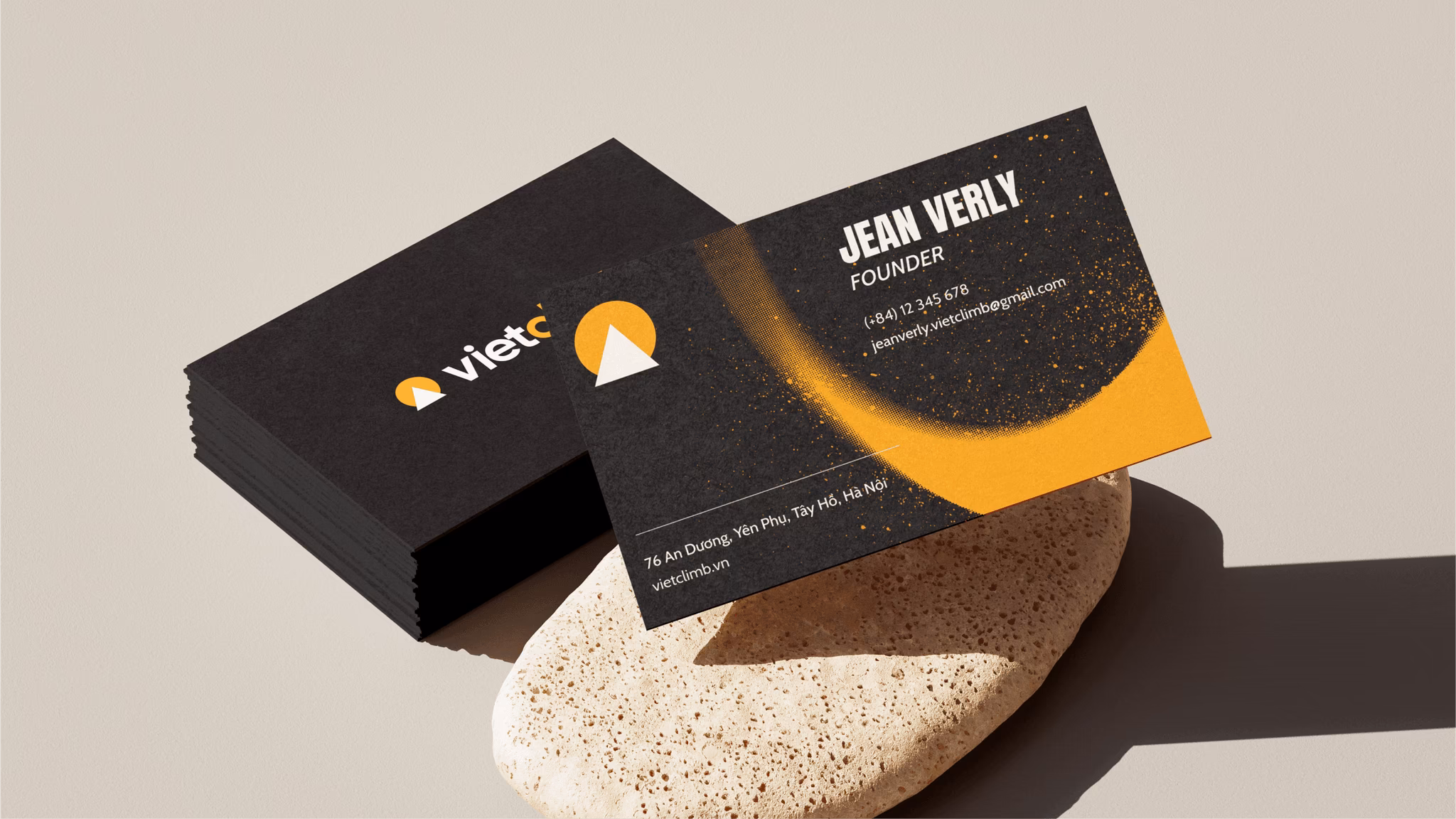 Black business card for Viet featuring a bold logo and name "Jean Verly, Founder," with abstract design elements.