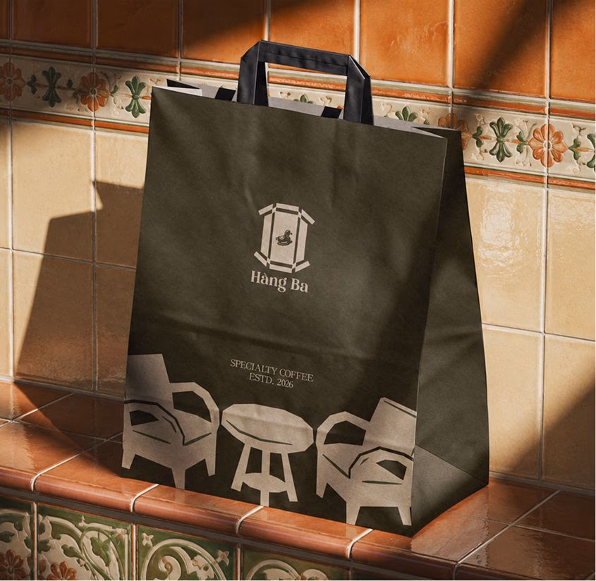 Recyclable Hang Ba shopping bag on kitchen counter with logo, handles and printed “Hang Ba” branding