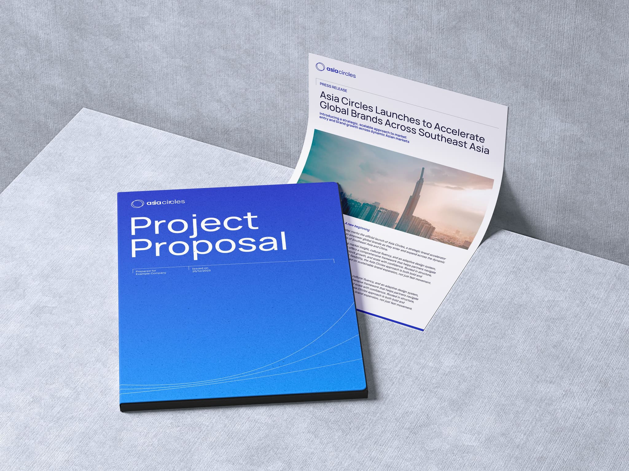 Blue project proposal document alongside a press release about accelerating global brands in Southeast Asia.